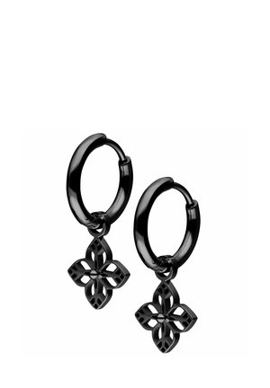 Black metal hoop earrings with dangling four-petal floral charms featuring openwork details and a central stud.