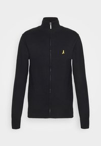 Black zip-up sweater with high collar, ribbed cuffs, and hem. Features a small yellow embroidered logo on the left chest.