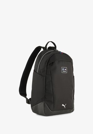 Sort Puma-rygsæk med BMW Motorsport-logo, polstrede skulderstropper og lynlåset hovedrum.