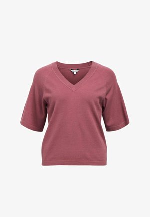 Top en maille rose poudré à manches courtes avec encolure en V et coupe décontractée sur fond blanc.