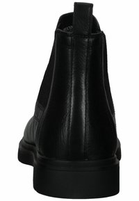 Stivaletto in pelle nera con pannelli laterali elastici, punta arrotondata e suola piatta. Presenta una texture liscia e un tassello posteriore per indossarlo facilmente.