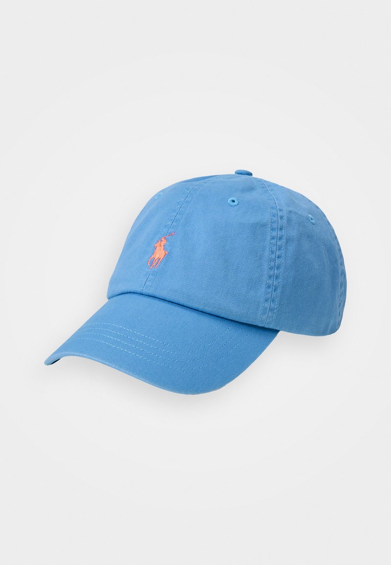 Light blue cotton baseball cap with a curved brim, featuring a small orange embroidered logo on the front. Six ventilation holes included.