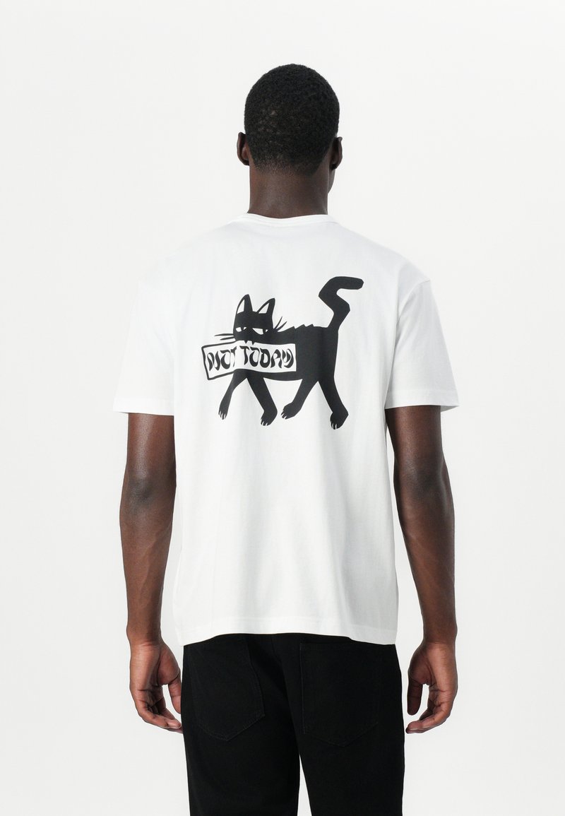 White cotton t-shirt featuring a black graphic of a cat and the text "NOT TODAY" on the back. Short sleeves, relaxed fit.