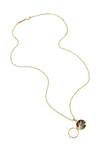 Gold-toned pendant necklace featuring a locket with a cat image on one side and a smooth, light-colored surface on the other.