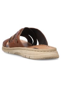 Sandale en cuir marron à glissière avec un dos ouvert, des détails cousus, des accents bleus et une semelle en caoutchouc texturée beige.