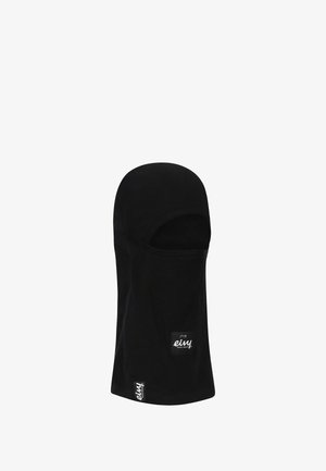 Balaclava noire en tissu doux et extensible. Présente un ajustement serré avec un visage ouvert et des étiquettes de marque sur le côté.