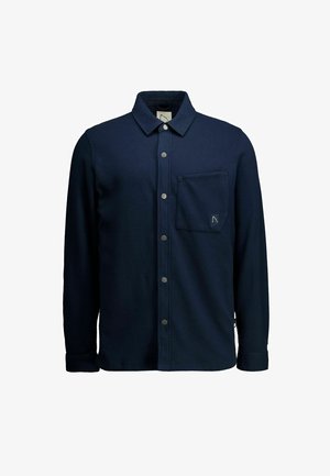 Sötétkék gombos ing texturált anyagból, mellkasi zsebbel, lekerekített gallérral és laza szabású hosszú ujjakkal.