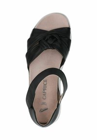 Must sageli mustast nahast sandaal, millel on sõlme kujundus varvaste kohal, pehme sisetald ja pahkluu rihm toe toetamiseks. Lihtne tallatüüp minimaalsete aktsentidega.