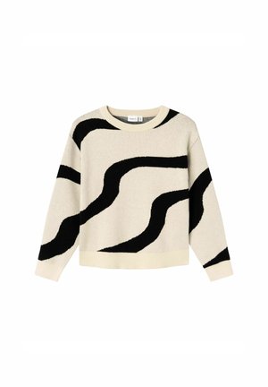 Pull crème avec des rayures noires ondulées abstraites sur le corps et les manches, doté d'un col rond et de poignets et ourlet côtelés.