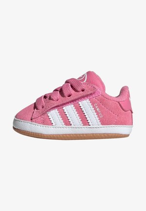 Pink suede sneaker with white zigzag stripes, pink laces, white sole, and gum outsole, labeled "Campus" on the side.