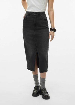 Black denim midi skirt with a front slit, high waist, and five pockets. Paired with gray socks and black loafers.