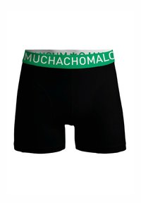 Fekete boxer alsónadrág zöld derékrésszel, amelyen fehér színnel "MUCHACHOMALO" felirat található. Puha, rugalmas anyagból készült.