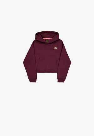 Bordo skraćena худи napravljena od mekanog materijala, sa prednjim džepom i malim logotipom na prsima. Dugački rukavi sa rebrastim manžetama.