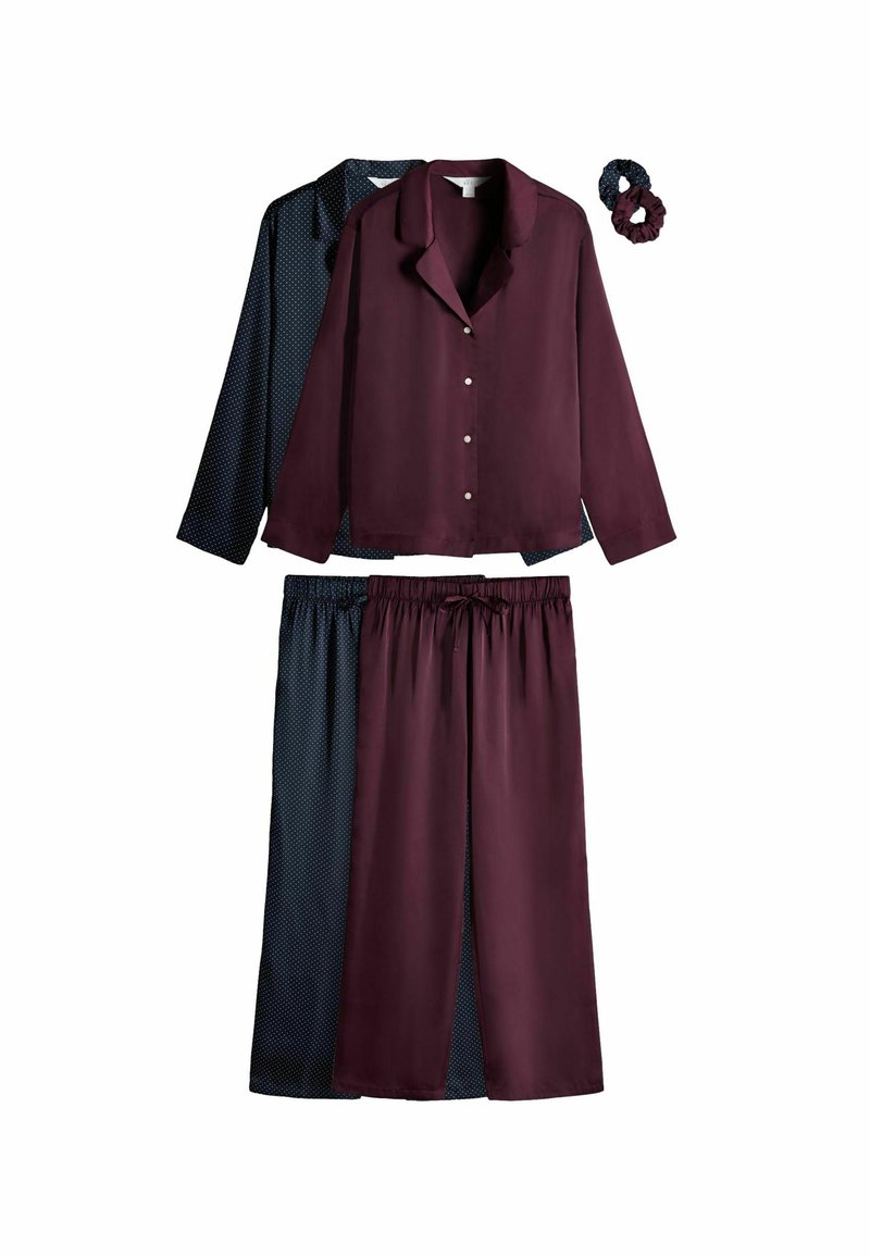 Conjunto de pijamas de seda que incluye una parte superior burdeos y pantalones a juego, con una capa inferior de lunares en azul marino; incluye una coleta a juego.