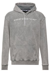 Grijze hoodie met een zachte textuur, een voorzak en witte tekst "GOOD FOR NOTHING" op de borst. Heeft een capuchon met trekkoord en geribde manchetten.