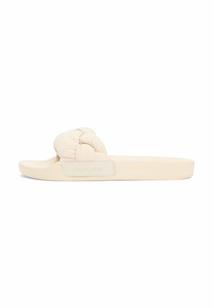 Beige slidesandal med en tyk, snoet polstret rem og flad sål, designet til afslappet brug.