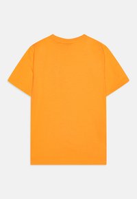 Orange cotton t-shirt with short sleeves, round neck, and a smooth texture. Minimalist design, no visible logos or patterns.