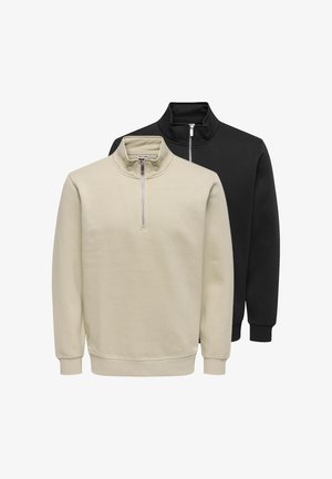 Zwei gefaltete Sweatshirts mit Viertel-Reißverschluss, eines beige vorne und eines schwarz dahinter, beide mit gerippten Bündchen und Kragen.