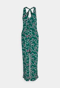 Grønt blomster-jumpsuit med V-hals og crossover-stropper. Har hvite konturer rundt rosa og burgunder blomster. Løs passform i bena.