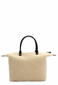 Beige, textured handbag made of fluffy material with black faux leather handles and accents. Features a spacious design and a zip closure.