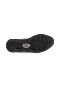 Black rubber sole with textured treads, featuring a gray and silver logo at the center. Shape is curved with traction patterns.
