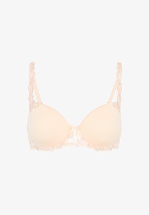 Beige-värinen toppaliivit, joissa pitsikoristeiset hihnat ja reunat sekä pieni keskellä oleva rusetti.