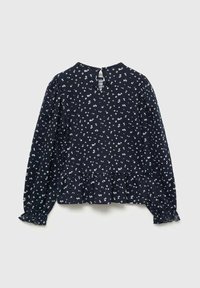 Marinblus med vita blommönster, långa puffärmar, peplumslut och ett nyckelhålsöppning på baksidan. Tillverkad av lättviktig tyg.