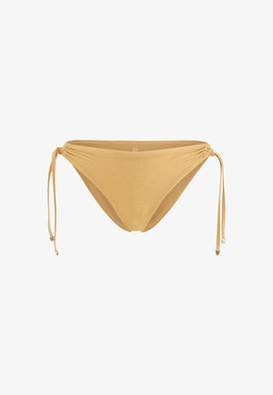 Gold bikini bottom with adjustable side ties. Smooth texture, minimal coverage, and metallic accents on the tie ends.