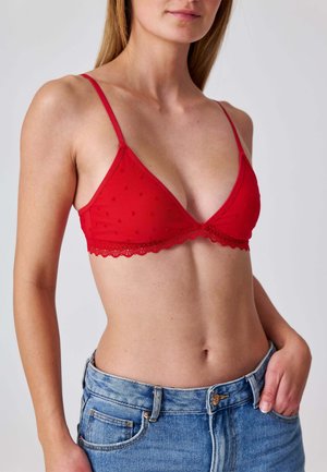 - Biustonosz z trójkątną miseczką