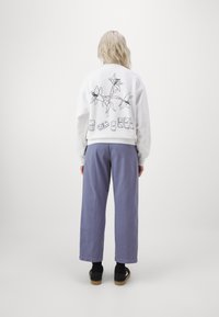 Carhartt WIP CARA PANT - Hlače - bay blue