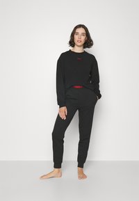 HUGO SPORTY LOGO PANTS - Pyjama bottoms - black