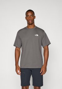 Gray short-sleeve t-shirt made of cotton, featuring a small white logo on the left chest and a classic crew neck design.
