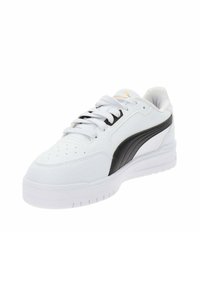 White sneaker with black and gold accents, made of smooth leather. Features lace-up design, perforated toe cap, and textured sole.