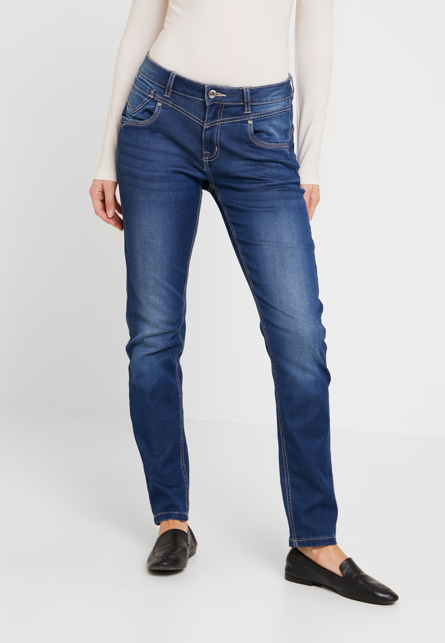 cream slim fit jeans