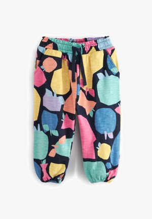 Børnebukser med elastisk talje med flerfarvede abstrakte frugtformer i gult, pink, blåt, grønt og sort, med sidelommer og ankelmanchetter.
