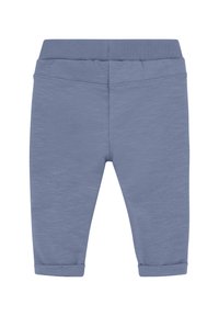 Lyseblå bomuldsbukser med en ribbet talje, indsnævrede ben og opbrettede manchetter. Stoffet har en diskret tekstur.