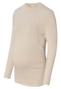 Beige Langarmtop aus dehnbarem Material, mit seitlicher Raffung, rundem Halsausschnitt und taillierter Silhouette, speziell für die Schwangerschaft entworfen.