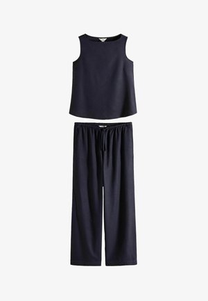 Sleeveless black top with a round neckline paired with loose black wide-leg pants featuring an elastic waistband and drawstring.