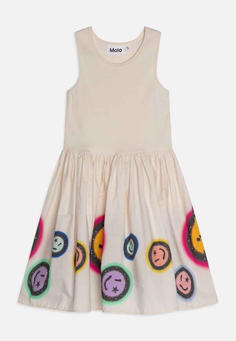 Robe sans manches en coton beige avec un corsage texturé et une jupe évasée, ornée d'imprimés colorés de visages souriants et d'une taille froncée.