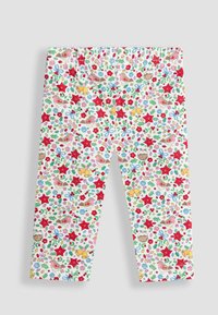 Leggings albe cu un imprimeu floral și animal colorat, decorate cu stele roșii și diverse flori mici, realizate dintr-un material moale și elastic.