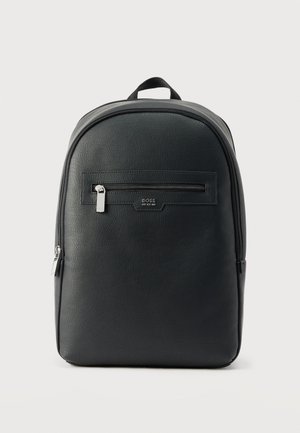 Black leather backpack with a front zippered pocket, silver zipper pulls, branded "BOSS" below the pocket, and a top carrying handle.