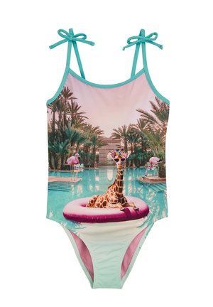 Jednodílné plavky s žirafou na růžovém plováku, tyrkysovými ramínky a tropickým pozadím u bazénu v pastelových barvách.