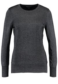 Svart långärmad tröja i ett glittrande stickat material. Rund halsringning, åtsittande modell med ribbade ärmslut och nederkant. Inga synliga mönster.