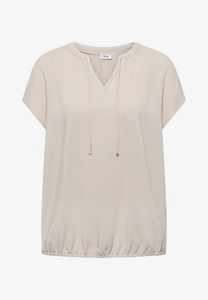 Beige kortærmet bluse med V-hals, snøre-detalje og elastisk kant, mærket "Cecil" på indersiden af kraven.
