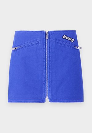 Blue denim mini skirt featuring a front zipper closure, two zippered pockets, and a logo patch on the waistband. Smooth fabric texture.