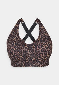Sujetador deportivo de estampado de leopardo hecho de tela suave, con un diseño de cuello halter y tirantes cruzados en la parte posterior para un ajuste seguro.