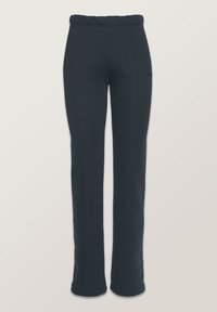 Czarne, elastyczne dresy z szerokim pasem i zwężającym się do dołu krojem nogawek. Materiał ma miękką fakturę, idealną dla komfortu i elastyczności.