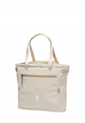 Beige tote bag with dual handles, front zippered pocket, and subtle logo, designed for everyday use and easy carrying.