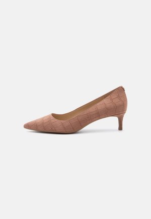 Pointed-toe, nude pink suede high heel shoe with crocodile texture pattern and a low stiletto heel on a white background.