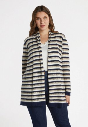 Cárdigan rayado con apertura frontal, que presenta rayas en azul marino, crema y dorado. Textura de punto, mangas largas y bolsillos laterales. Ajuste casual.